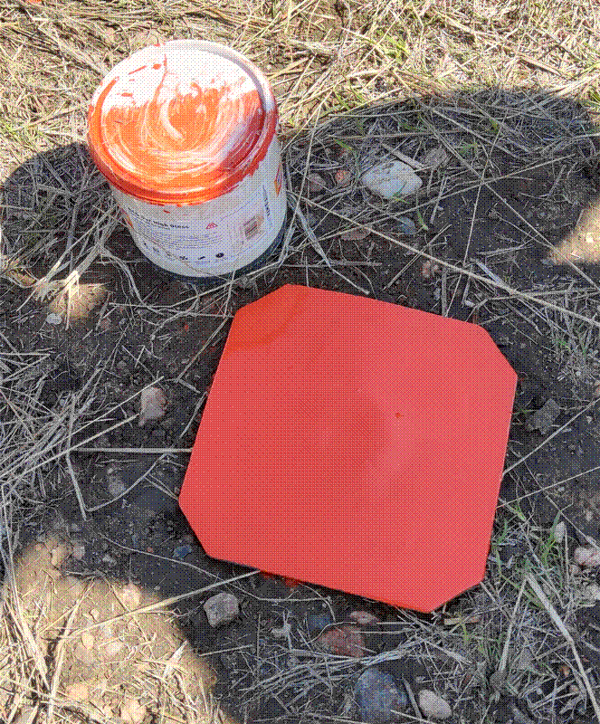 A metal plate used to mark the corner of a plot in Namibia.