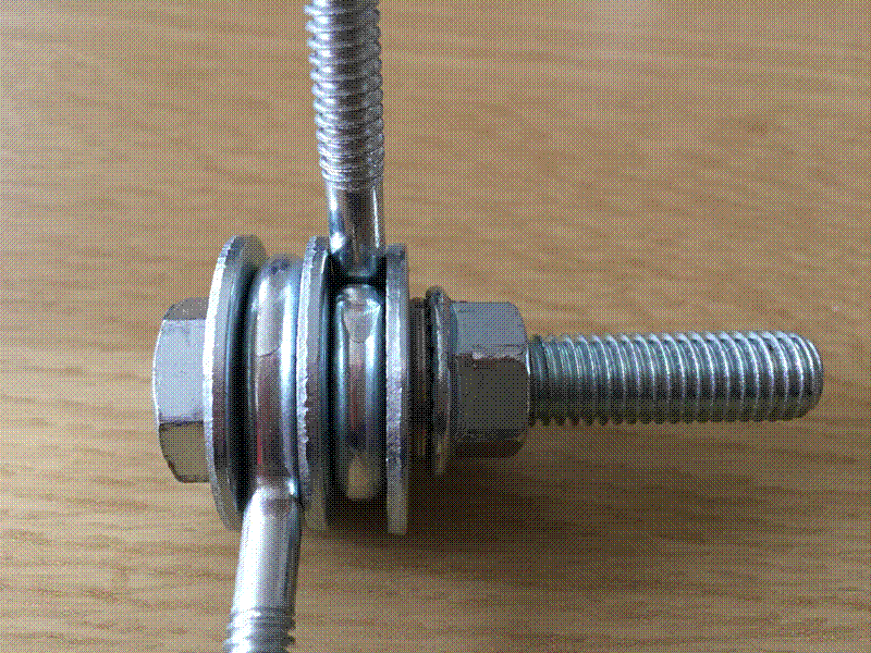 Tightened eye bolt washer stack