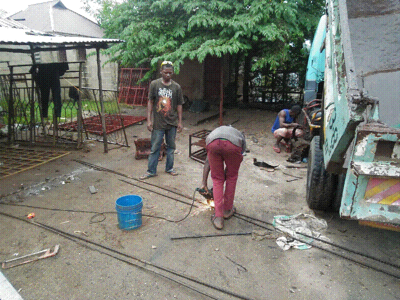 Cutting lengths of re-bar to 1.5 m and 2 m length in Tanzania